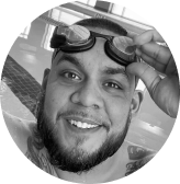 Adaptive Athlete Adam Lucio wearing swim goggles on head