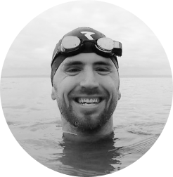 Man sticking head out of open water